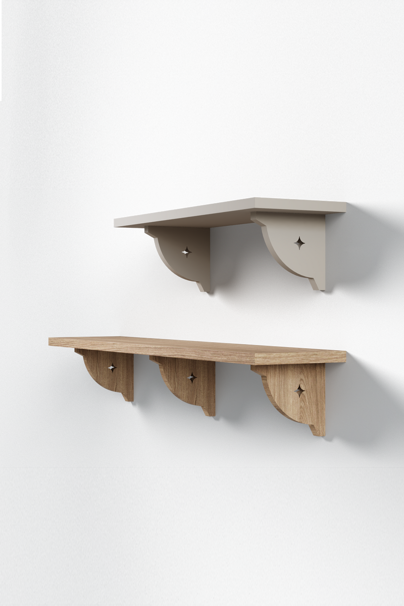 Isla Porter's Alma shelf style with a four-pointed star cutout in the brackets shown in two variations: the top two-bracket shelf is painted white, and the bottom three-bracket shelf is a natural wood stain.