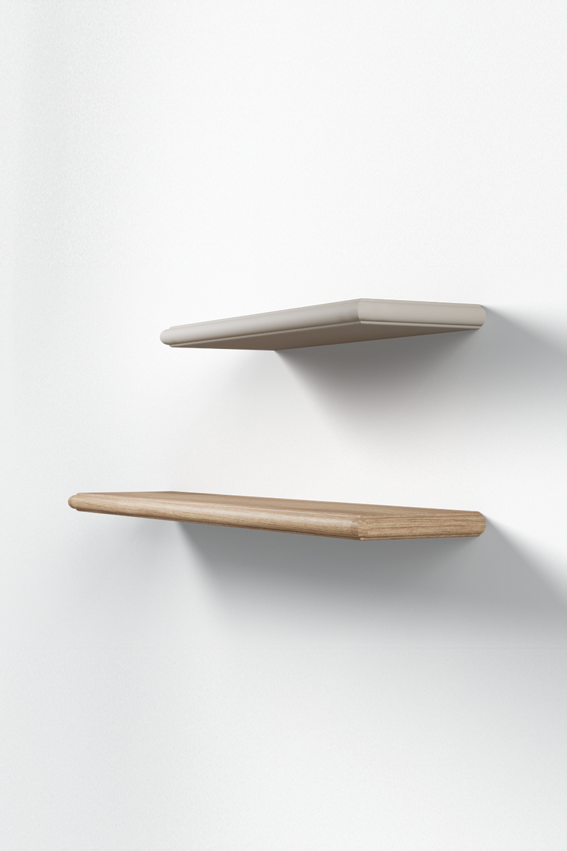 Two minimalist floating shelves in the Dane style with cove-and-bead edge detail. The shorter top shelf is painted white while the longer bottom shelf is a natural wood stain.